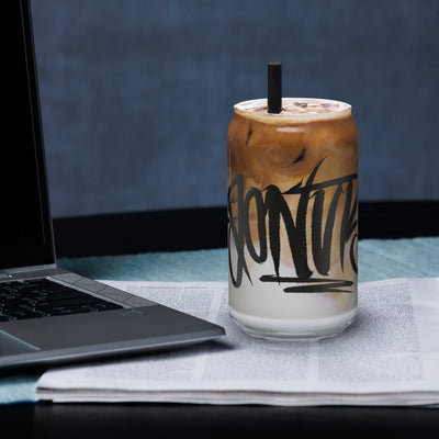 A clear 16 ounce glass blown in the shape of a modern soda can tagged with "Donuts" Graffiti.